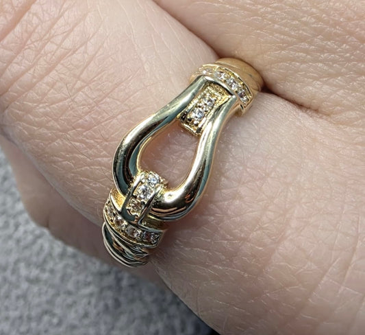 14K solid gold buckle ring with stones.