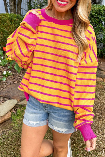 Orange and pink striped loose fit sweater