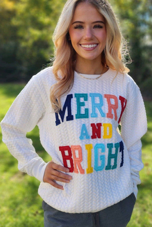 White “Merry and Bright” sweatshirt. GCollection