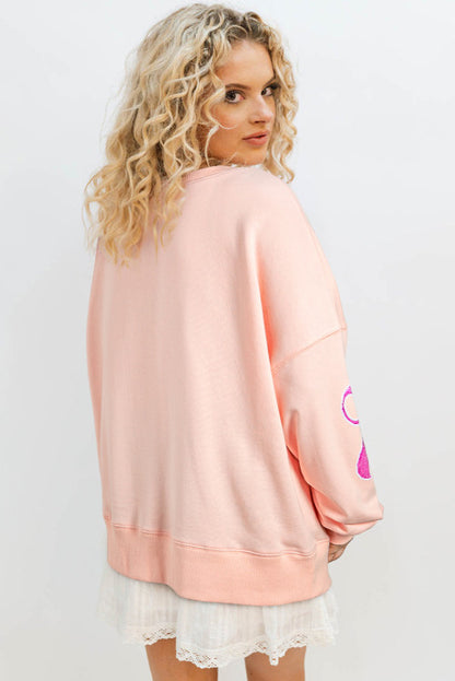 Apricot and sequined bows oversized sweatshirt. GCollection