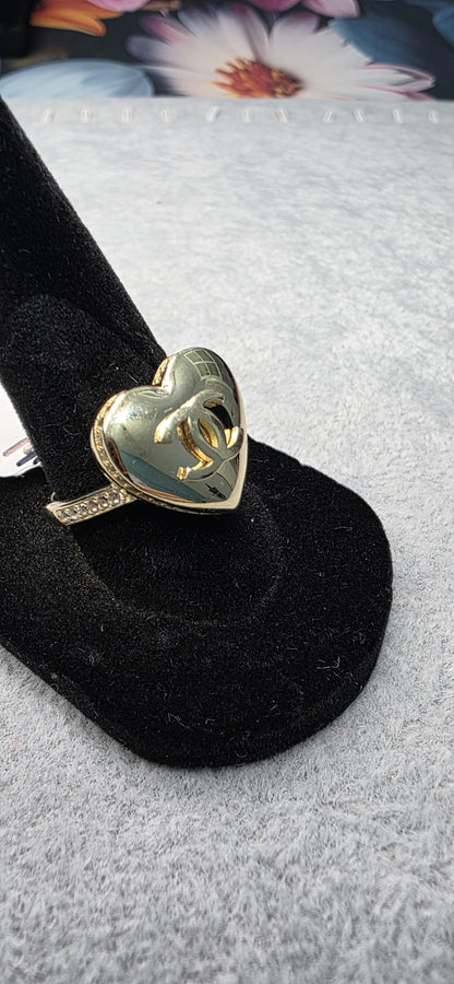 14K solid gold CC puffy heart ring with white stones.